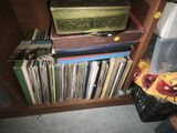 many books on a shelf next to a basket of books