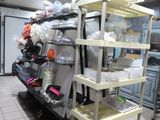 a kitchen with a lot of dishes on the shelves