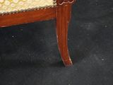 an upholstered upholstered chair with a yellow and white upholstered upholstered seat
