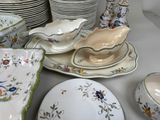 many plates and bowls that are sitting on a table