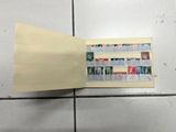 a piece of paper on the floor with stamps on it