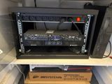a rack with a bunch of electronic equipment on it