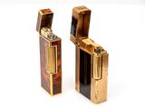two lighters sitting side by side on a white surface