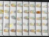 many oplite stones in a black box on a table