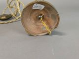 pair of brass plated candlesticks with a rope wrapped around the base