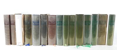 books are lined up in a row on a white surface