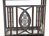 an image of a metal cage with a fish design on it