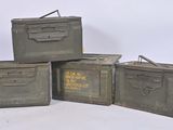 three military boxes are stacked on top of each other on a white surface