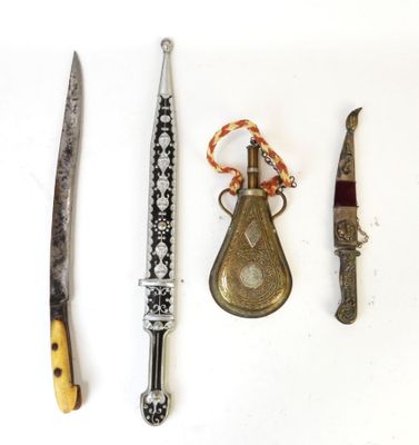 three different types of knives on a white surface