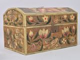 a small wooden box with a floral design on it