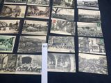 a lot of old black and white photos on the table