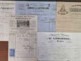 some old papers are sitting on a wooden table