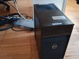 a dell desktop computer sitting on a hard wood floor