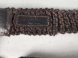 an image of a close up of a knife on a rope