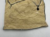 an old piece of paper with a string attached to it