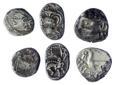 six ancient roman coins with faces and heads on them