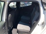 the back seat of a car with the door open in a parking lot