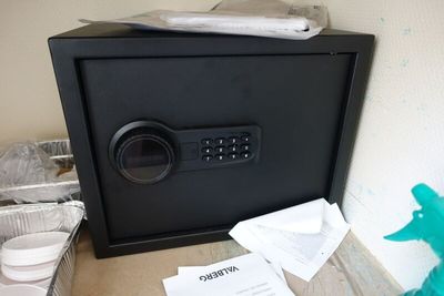 a black safe box sitting on top of a counter