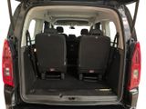 the back of a van with four seats in the back of it