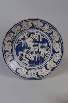 a blue and white plate with a design on it