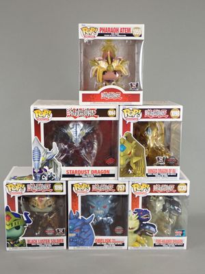 five boxes of action figures are stacked on top of each other