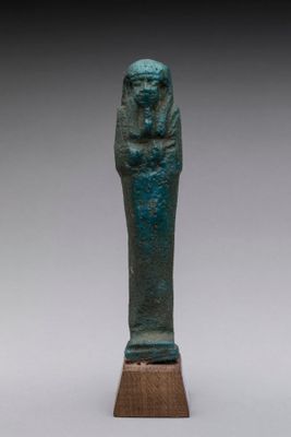 an egyptian bronze statue of a pharaoh