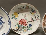 three plates with different designs on them on a table