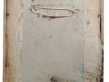 an old picture of a piece of paper with a safety pin on it
