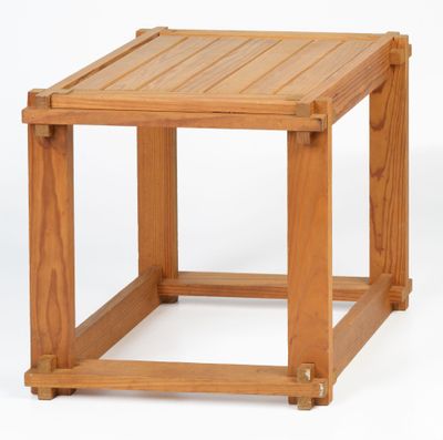 the side table is made of wood and has a square top