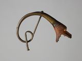 an image of a metal bird with a curved tail