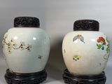 pair of chinese vases with birds and flowers painted on them