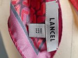 a close up of a necktie with a label on it