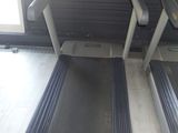 two tread machines that are on the floor in the room