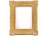 a gold picture frame on a white wall with a white background