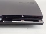 a close up of a black playstation game console