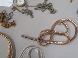 many different types of jewelry on the table