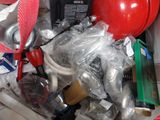 a red fire hydrant in the middle of a pile of other items