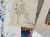 several drawings of a man sitting on a chair next to a pile of papers