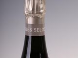 a bottle of wine that is sitting on a table