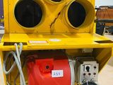 a yellow traffic light sitting on top of a cart