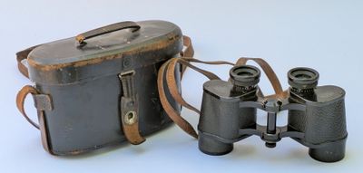 two binoculars sitting next to each other on a white surface