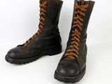 pair of black leather boots with brown laces on a white background