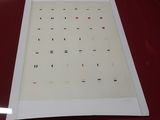 a sheet of paper on a table with a red table cloth