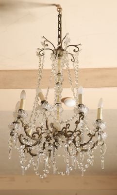 a chandelier hanging from the ceiling in a room