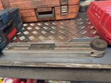 some tools are sitting on top of a table in a room