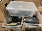 a box with a camera, a camera case, and other items in it