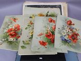 four cards with flowers on them sitting on top of a table