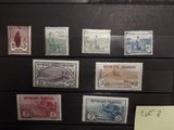 a lot of stamps that are on display in a case
