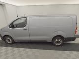 a picture of a silver van parked in a garage
