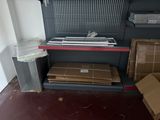 a shelf with boxes and a keyboard on it